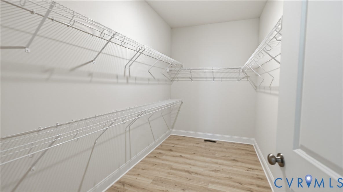 12344 Garnet Parke Circle, Short Pump Area, Glen Allen, VA 23059 Primary Walk-in closet with wire shelving system and wood-finish flooring