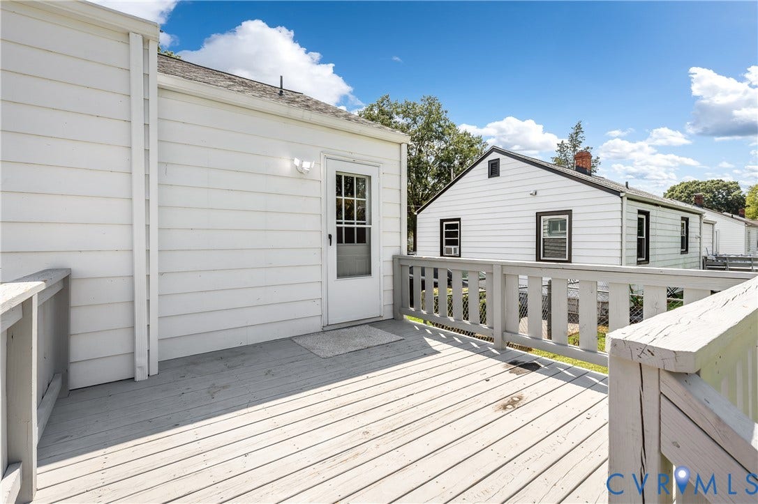 Wood-finish deck with a painted railing system