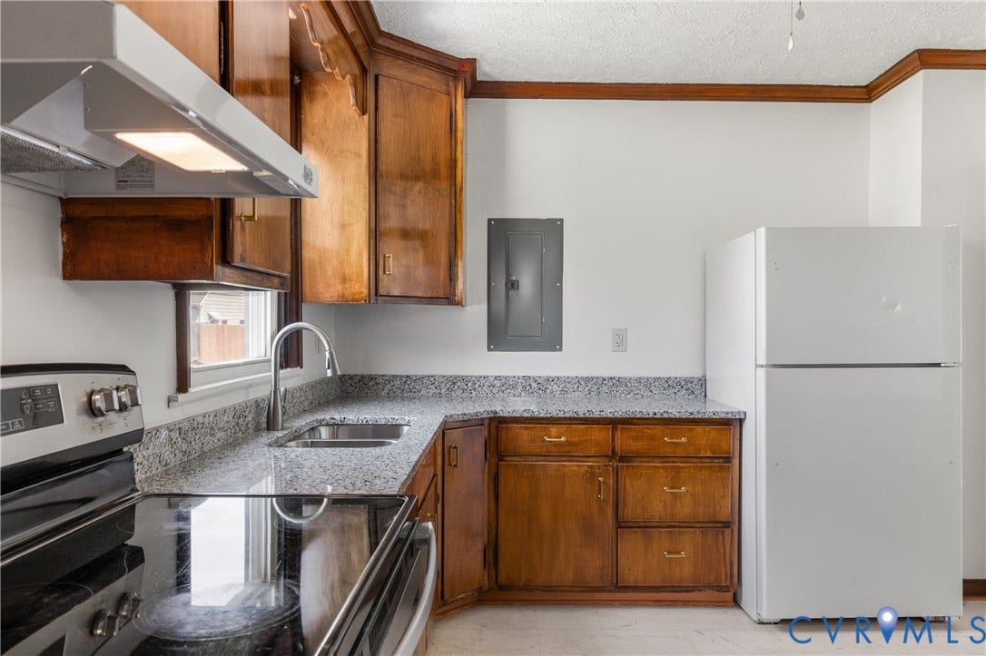 Wood-finish cabinetry paired with light-toned countertops