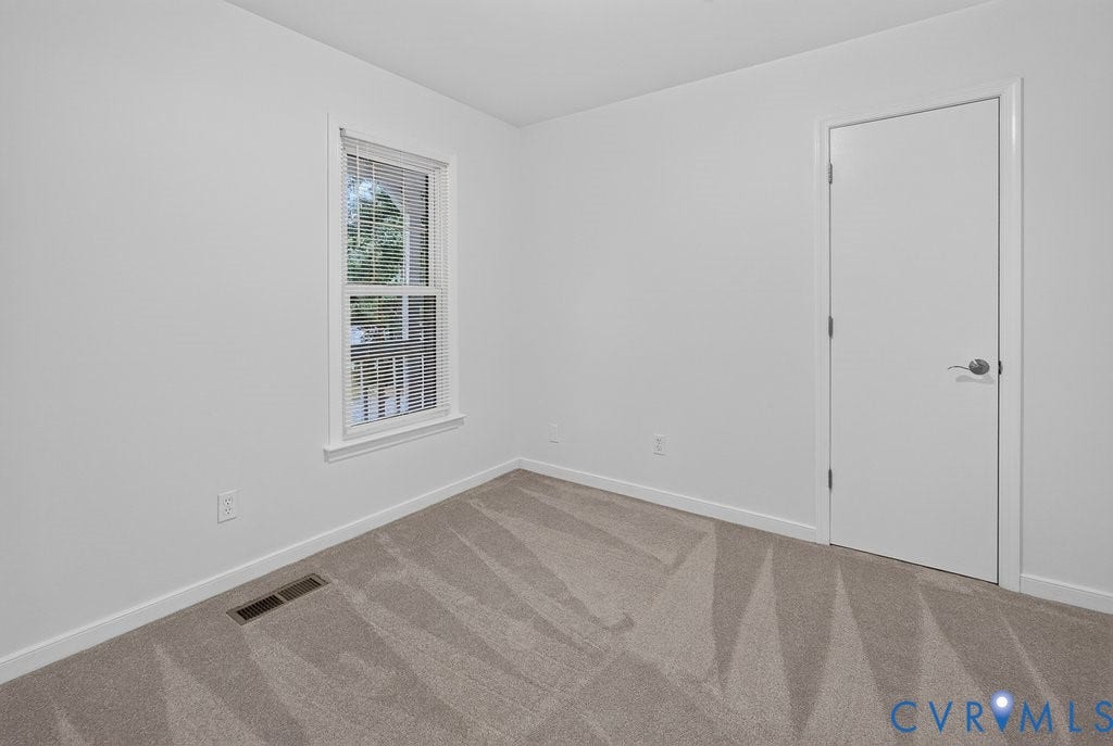 3112 Castlebury Drive, Chester, VA 23831 Neutral wall tones, carpeted flooring, window with blinds, and white interior door
