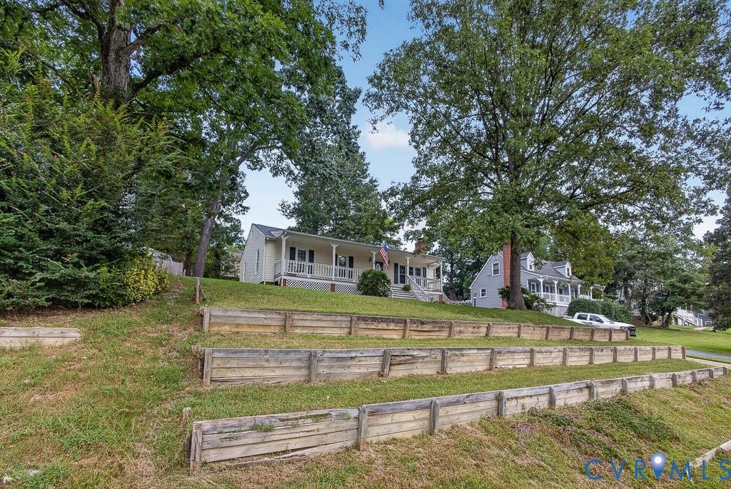 3112 Castlebury Drive, Chester, VA 23831 Expansive tiered landscaping with wood retaining walls