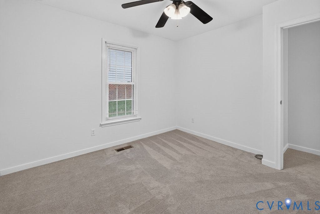 3112 Castlebury Drive, Chester, VA 23831 Neutral-toned carpeting, white walls, and a window with blinds