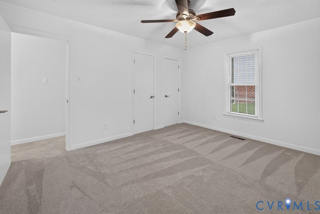 3112 Castlebury Drive, Chester, VA 23831 Neutral carpet flooring, white painted walls, ceiling fan with integrated lighting, window with blinds, and white panel doors
