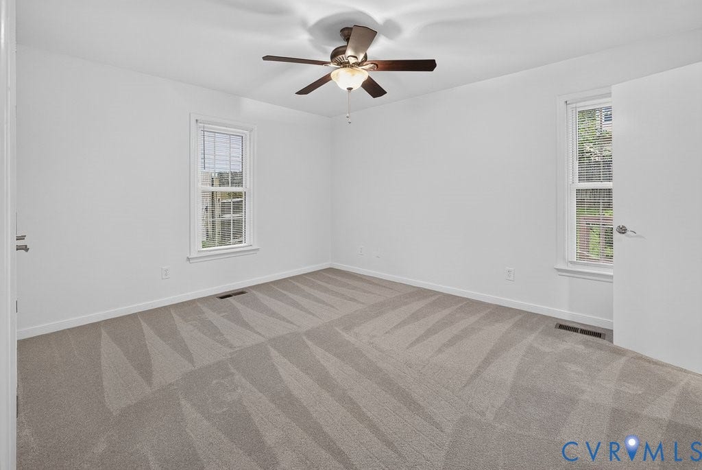 3112 Castlebury Drive, Chester, VA 23831 Neutral-toned wall-to-wall carpeting, two windows with white trim, and a ceiling fan with integrated lighting