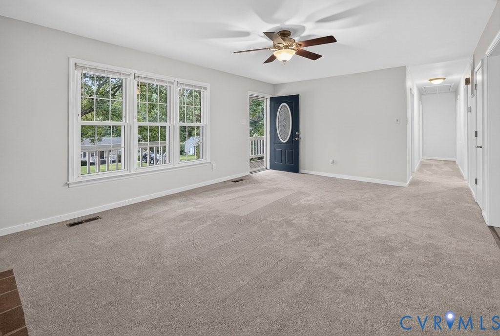 3112 Castlebury Drive, Chester, VA 23831 Expansive neutral-toned carpeting, triple pane windows, and a ceiling fan with integrated lighting