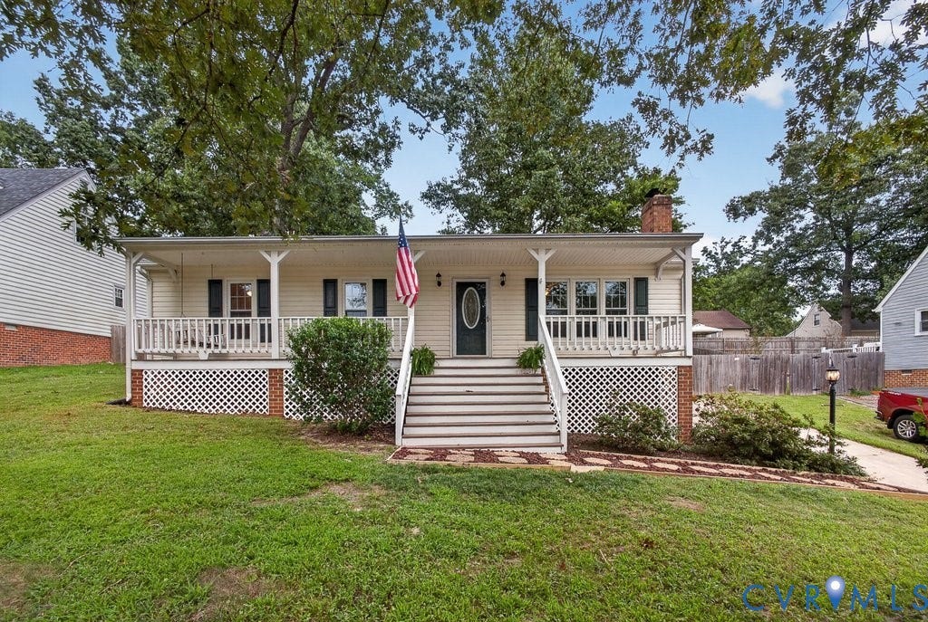 3112 Castlebury Drive, Chester, VA 23831 Front exterior with covered porch, white railing, and exterior shutters