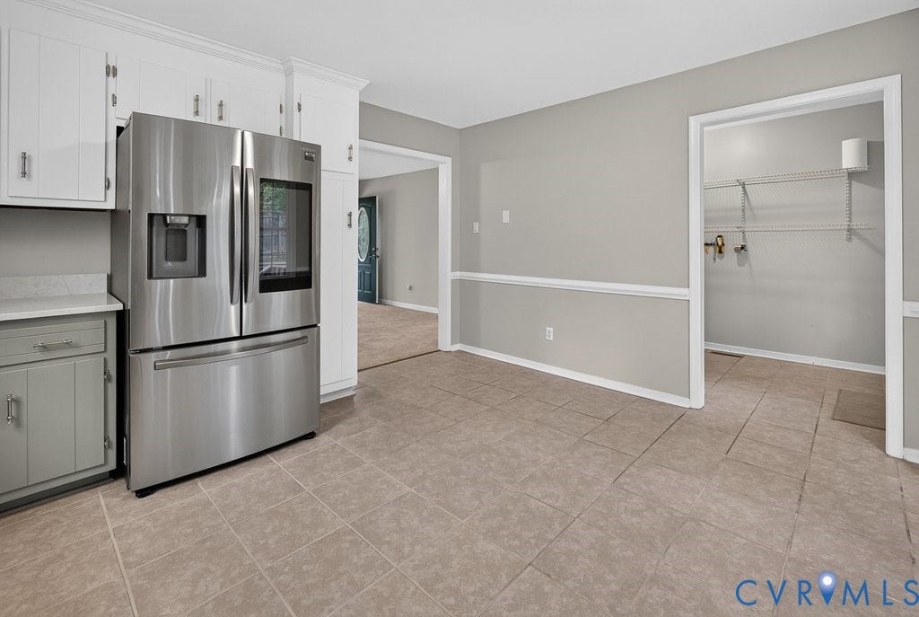 3112 Castlebury Drive, Chester, VA 23831 Stainless steel French door refrigerator, white upper cabinetry, light gray lower cabinetry, and light-toned tile flooring