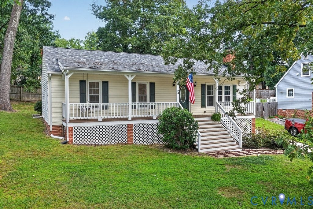 3112 Castlebury Drive, Chester, VA 23831 Exterior featuring light-colored siding, a covered front porch with white railing, a dark shingle roof, and brick foundation accents