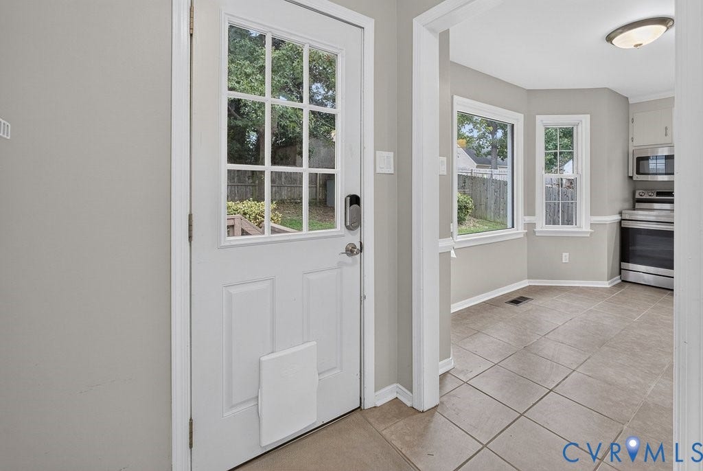 3112 Castlebury Drive, Chester, VA 23831 Kitchen area with tile flooring, stainless steel appliances, and multiple windows
