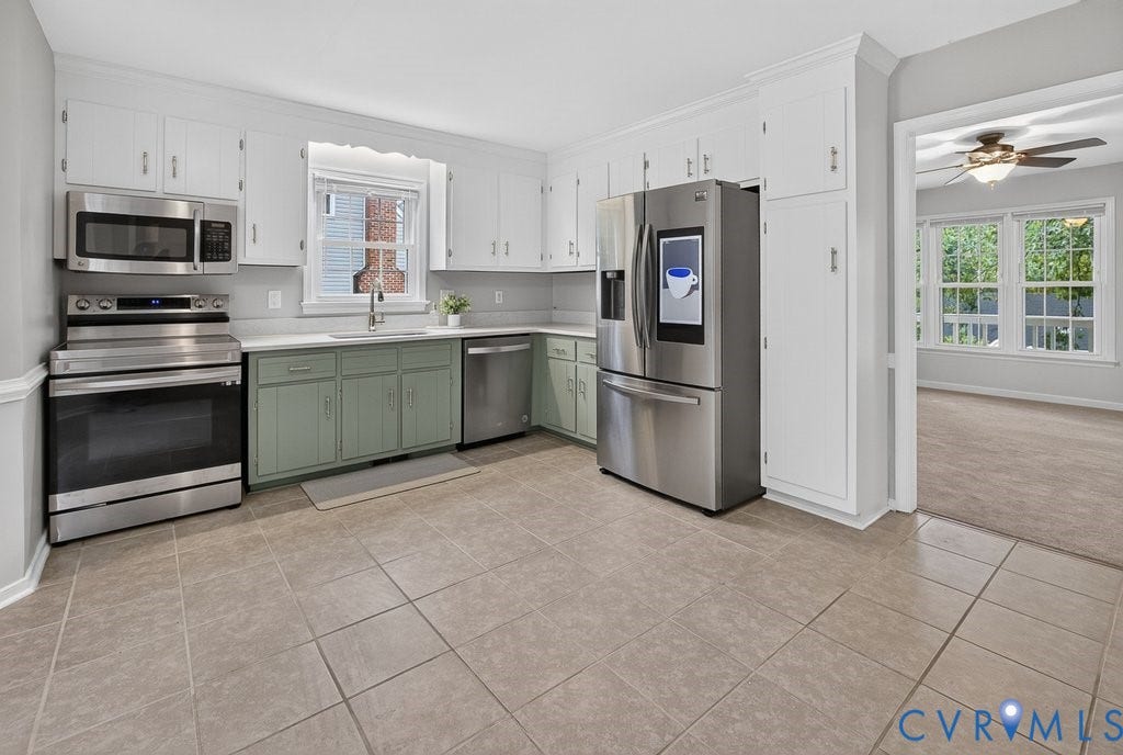 3112 Castlebury Drive, Chester, VA 23831 Kitchen featuring stainless steel appliances, tile flooring, white upper cabinetry, and green lower cabinetry