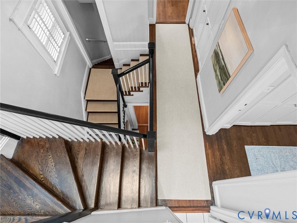 3403 W Franklin Street, Museum District, Richmond, VA 23221 Hardwood staircase with white balusters and a dark handrail
