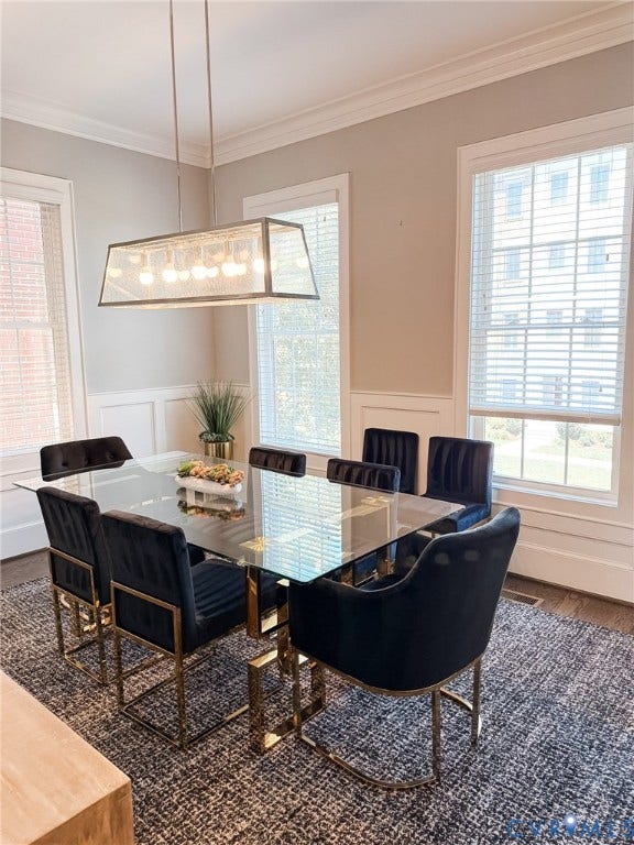 3332 Haydenpark Lane, Henrico, VA 23233 Elegant dining room featuring a glass-top table with brass-finished base, black upholstered dining chairs with metal frames, and a geometric pendant light fixture with frosted glass panels