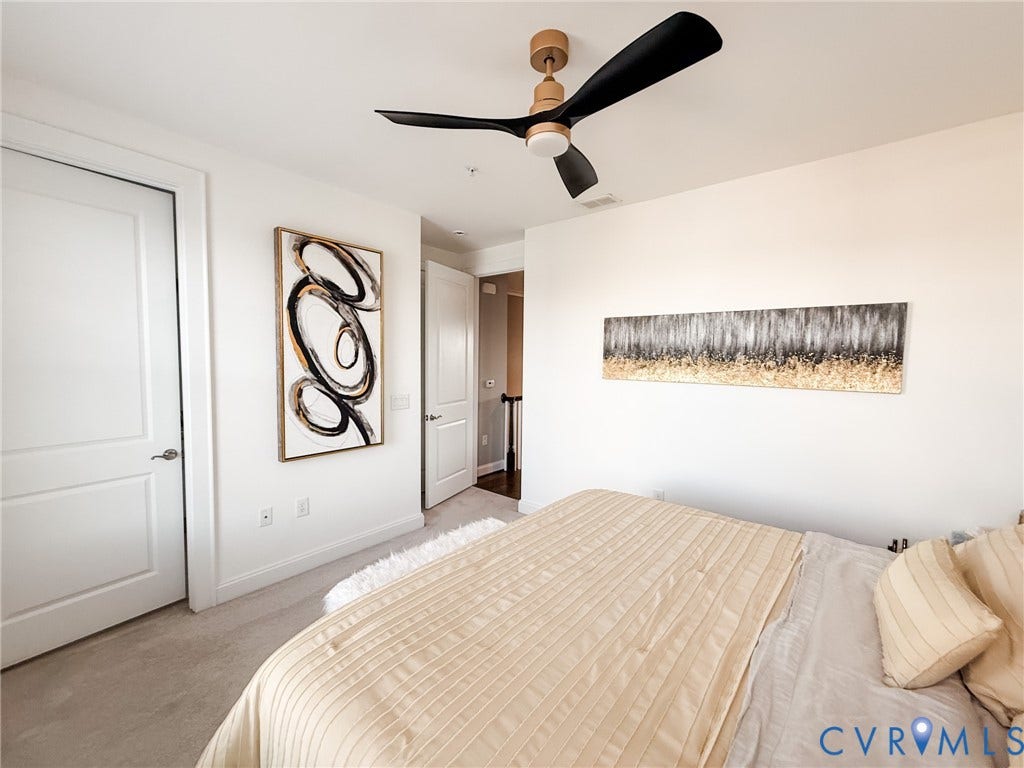 3332 Haydenpark Lane, Henrico, VA 23233 Ceiling-mounted fan fixture with three blades, white walls, and light-colored carpeting
