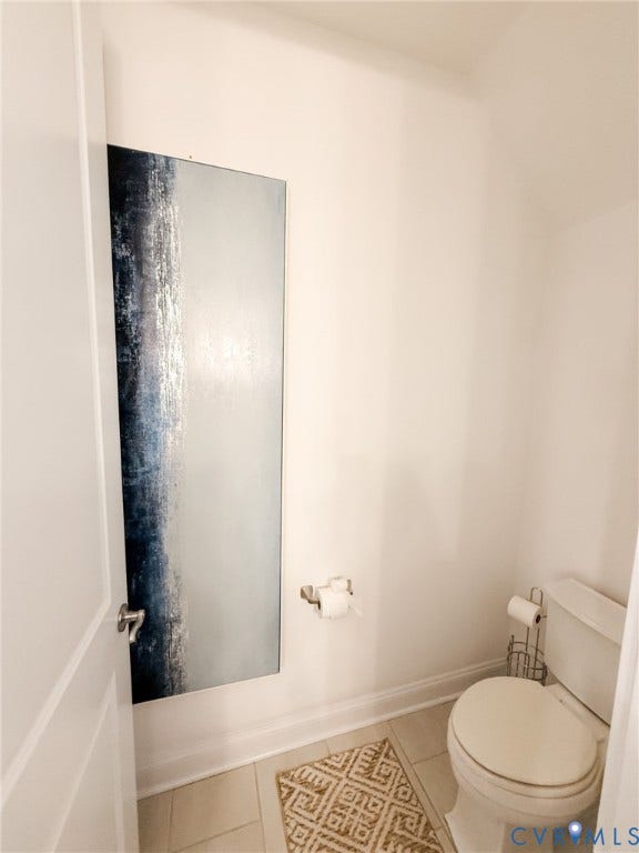 3332 Haydenpark Lane, Henrico, VA 23233 White paneled door with brushed nickel hardware, white walls, and light-toned tile flooring
