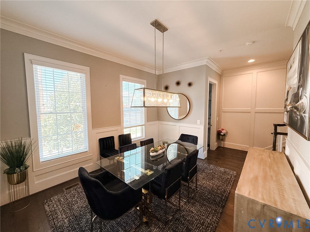3332 Haydenpark Lane, Henrico, VA 23233 Hardwood flooring, extensive crown molding, wainscoting, recessed lighting, and a modern rectangular chandelier