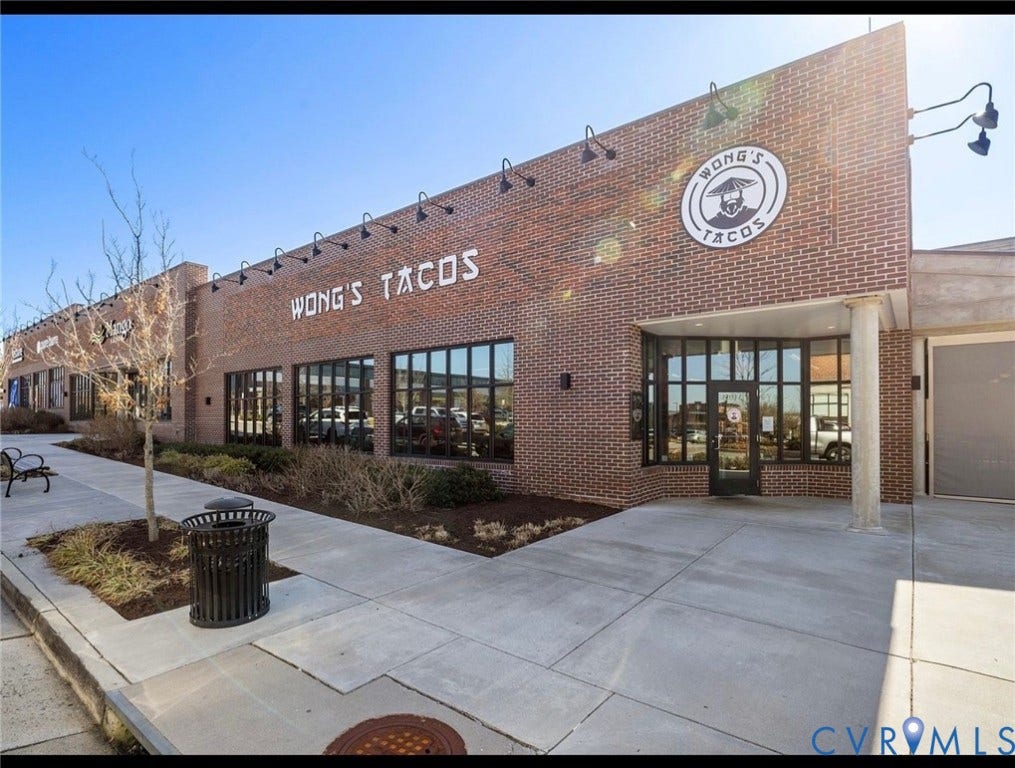 3332 Haydenpark Lane, Henrico, VA 23233 Modern brick commercial storefront featuring large multi-pane windows, prominent signage, and a clean concrete plaza entry