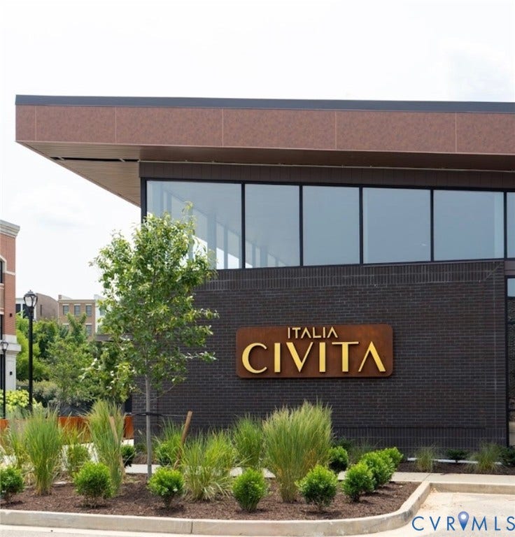 3332 Haydenpark Lane, Henrico, VA 23233 Modern commercial exterior featuring dark brick, expansive window panels, a prominent signage display, and a landscaped frontage with diverse plantings