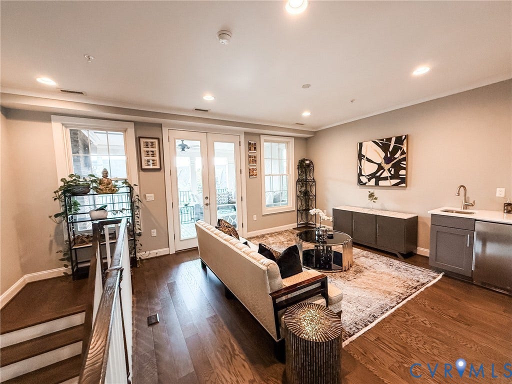 3332 Haydenpark Lane, Henrico, VA 23233 Bright open-concept living space featuring hardwood flooring throughout, recessed ceiling lighting, and French doors with transom windows opening to natural light