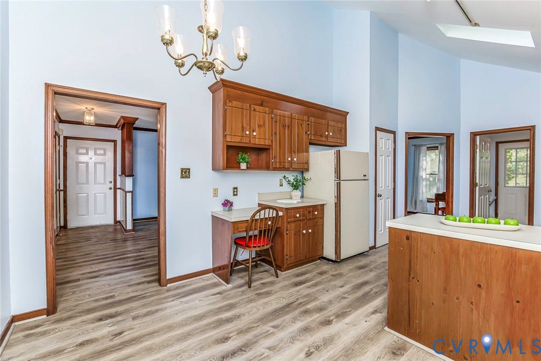 Wood-finish flooring, vaulted ceilings, skylight, and recessed lighting