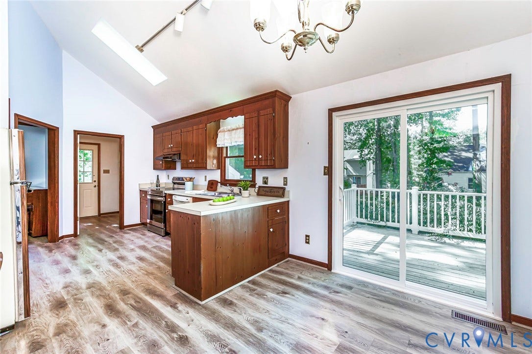 Vaulted ceiling with skylight and track lighting