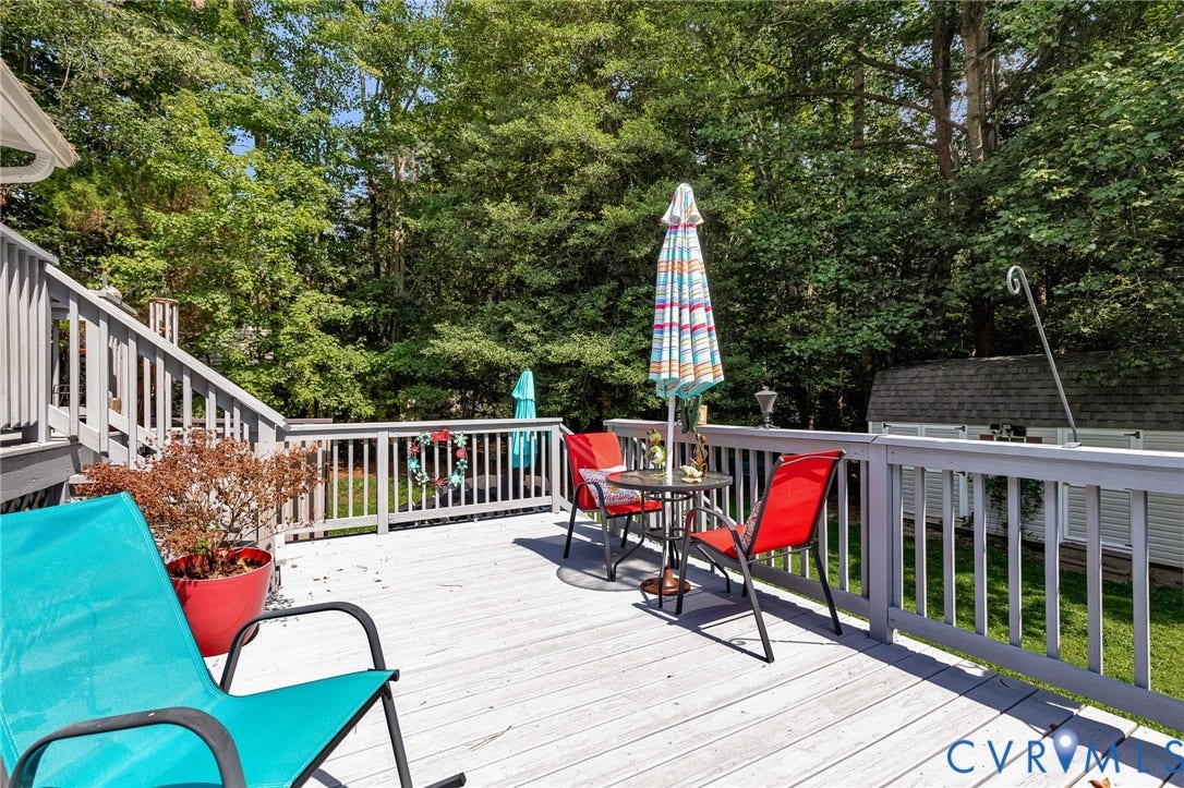 Expansive wood deck with railing system and integrated staircase