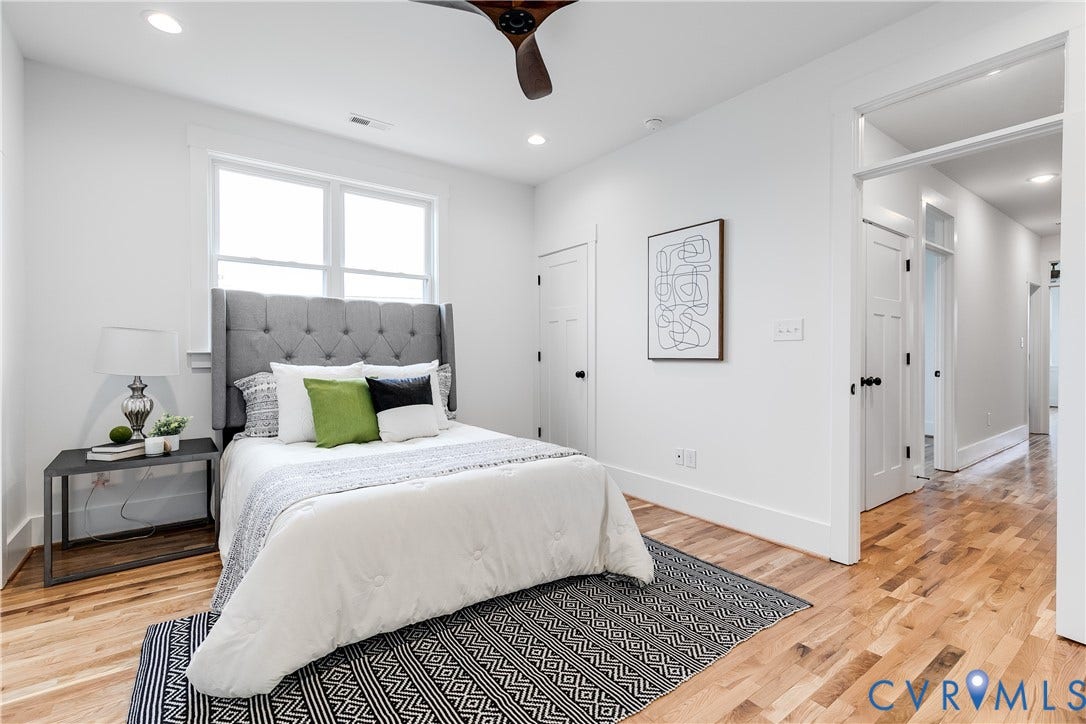 Example by same builder featuring transom over doors, LVP and recessed lighting.