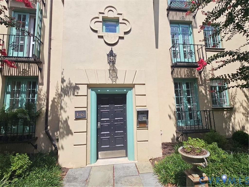 505 N Arthur Ashe Boulevard, #U3, Richmond, VA 23220 Stucco exterior with decorative window grilles and wrought iron balconies