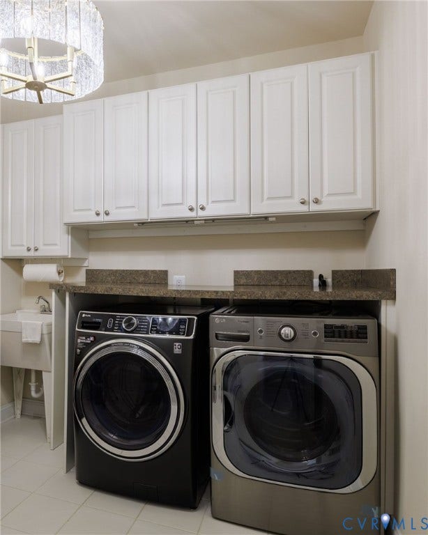 Side by Side Washer & Dryer.  Utility sink.  Custom Cabinets.  Chandelier.