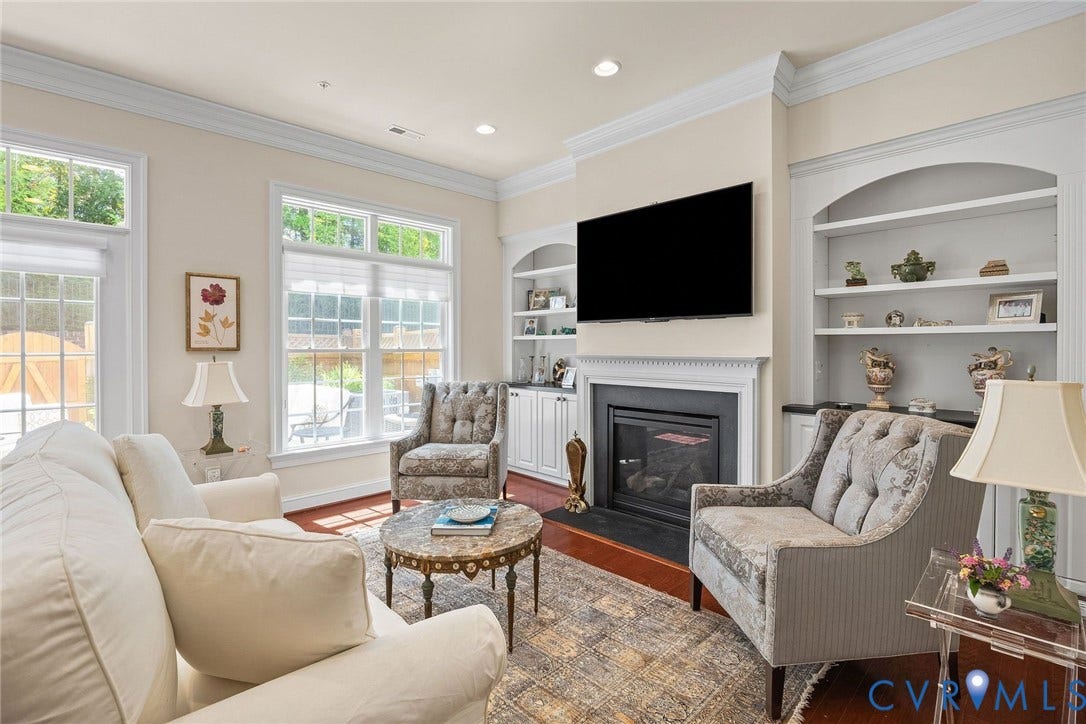 Fireplace, Built-in Shelving and Cabinets, Gas Fireplace, Crown Mouilding, Recessed Lighting, Beautiful Natural Light.