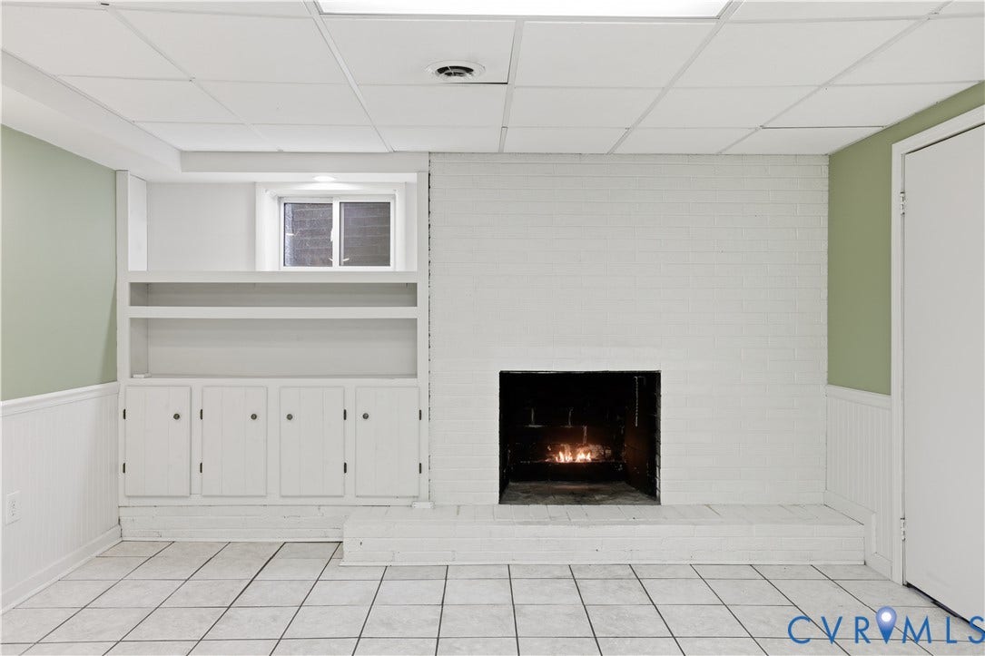 Built in shelving, wood burning fireplace