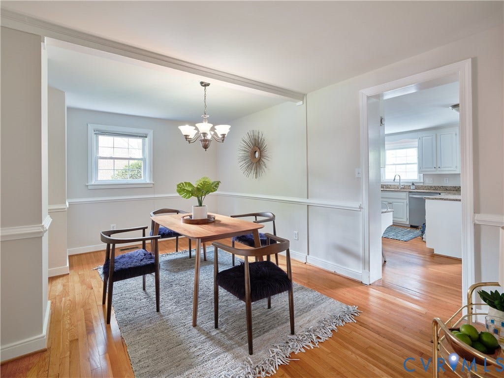 1311 Santa Rosa Road, Henrico, VA 23229 Bright, open dining area featuring hardwood flooring, wainscoting with crisp white trim, and a pendant light fixture