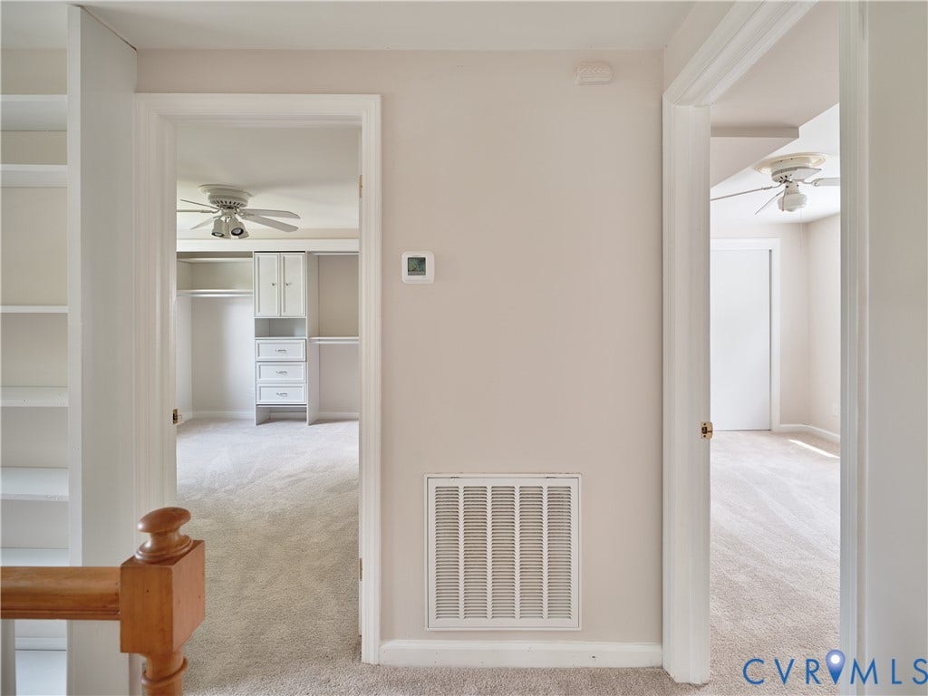 1311 Santa Rosa Road, Henrico, VA 23229 Built-in shelving, wood newel post, neutral wall color, built-in closet organization system, and ceiling fan
