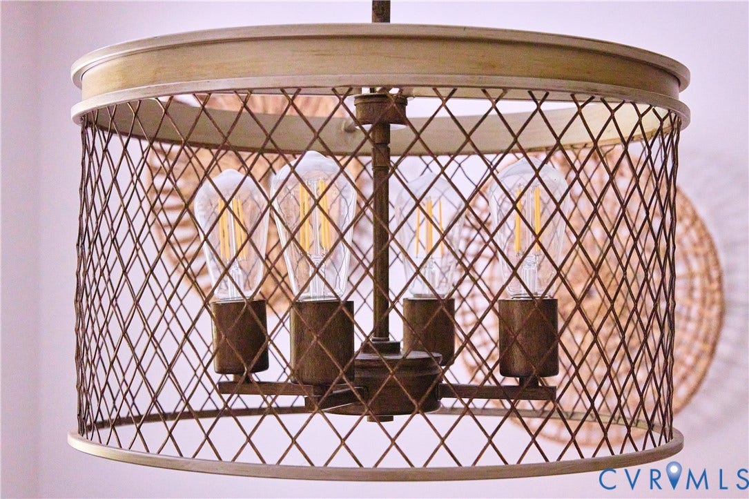 1311 Santa Rosa Road, Henrico, VA 23229 Industrial-style pendant light with a distressed metal cage and exposed filament bulbs