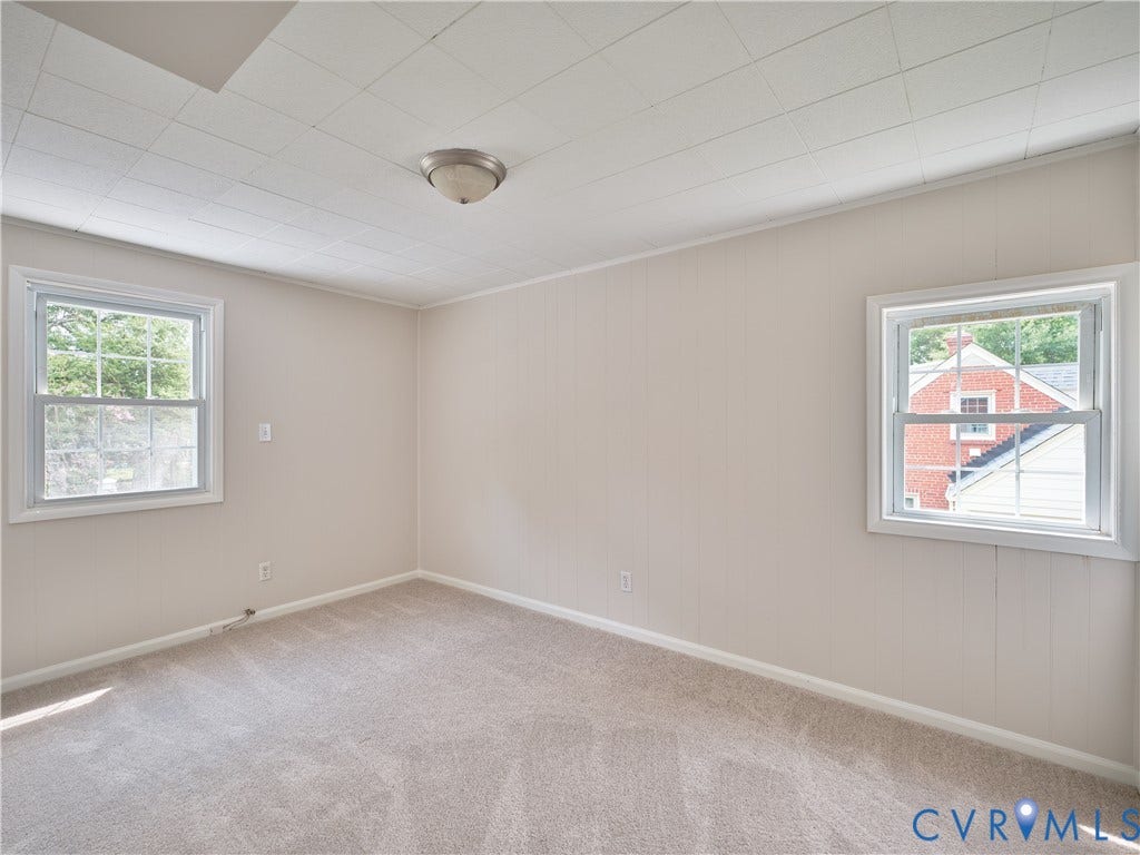 1311 Santa Rosa Road, Henrico, VA 23229 Neutral tone wall paneling with carpet flooring