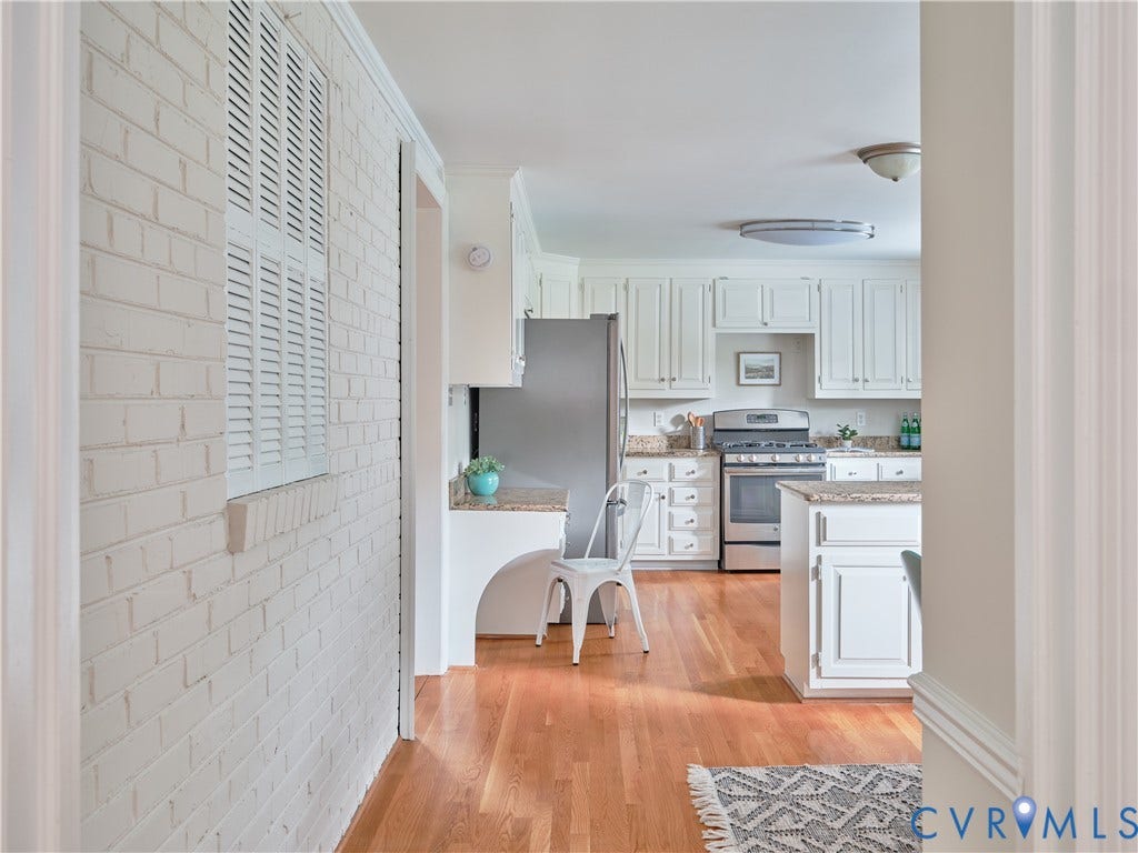 1311 Santa Rosa Road, Henrico, VA 23229 Kitchen featuring white cabinetry, granite countertops, stainless steel appliances, and wood-finish flooring