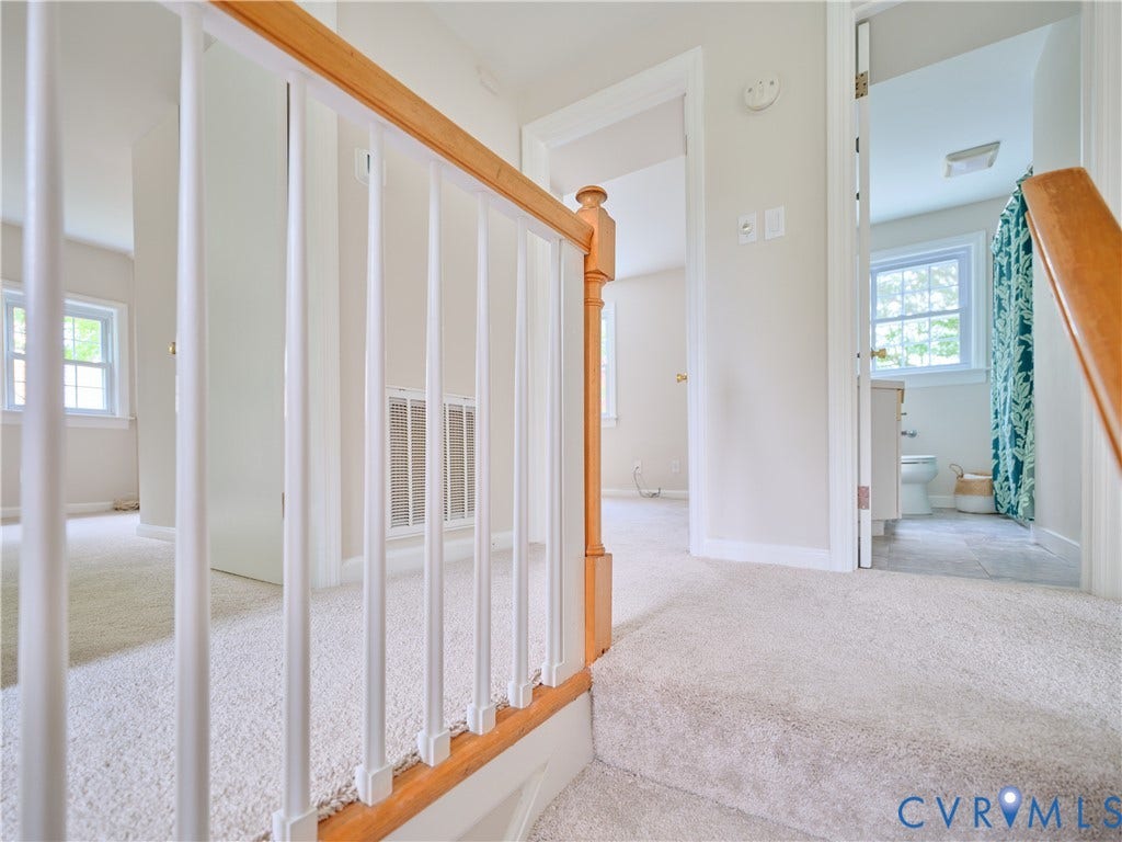 1311 Santa Rosa Road, Henrico, VA 23229 Carpeted staircase with wood-finish handrail and white balusters