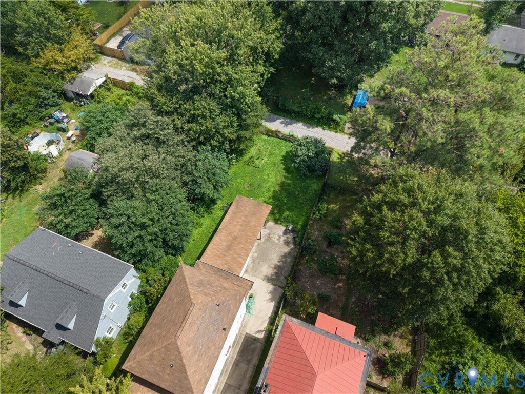 2314 Ingram Avenue, Richmond, VA 23224 Property featuring a detached garage, mature trees, and a concrete driveway
