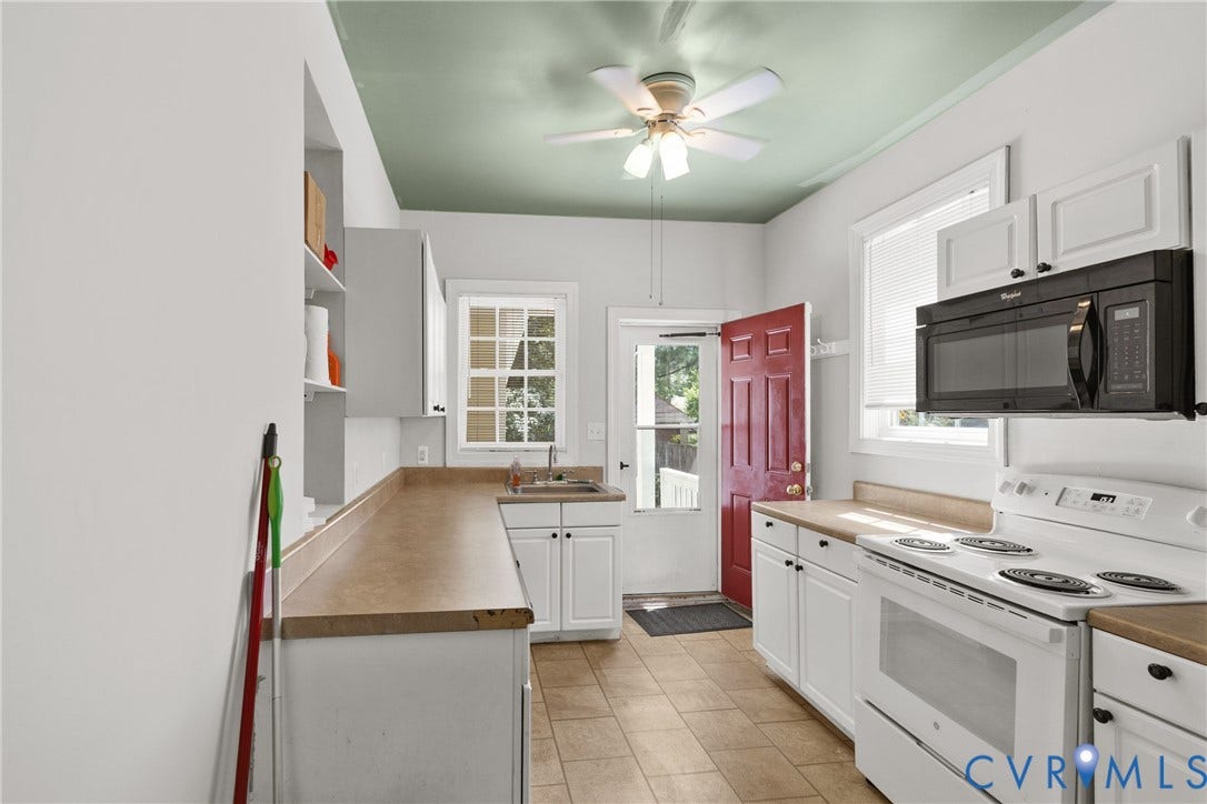 2314 Ingram Avenue, Richmond, VA 23224 Galley kitchen with white cabinetry, wood-finish countertops, ceramic tile flooring, and a ceiling fan
