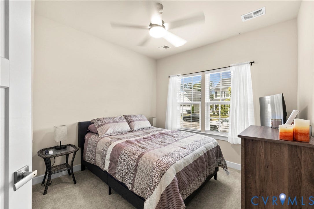 11319 Vulcan Lane, Bermuda, Chester, VA 23831 Room featuring carpet flooring, a ceiling fan with integrated lighting, and a double window with blinds