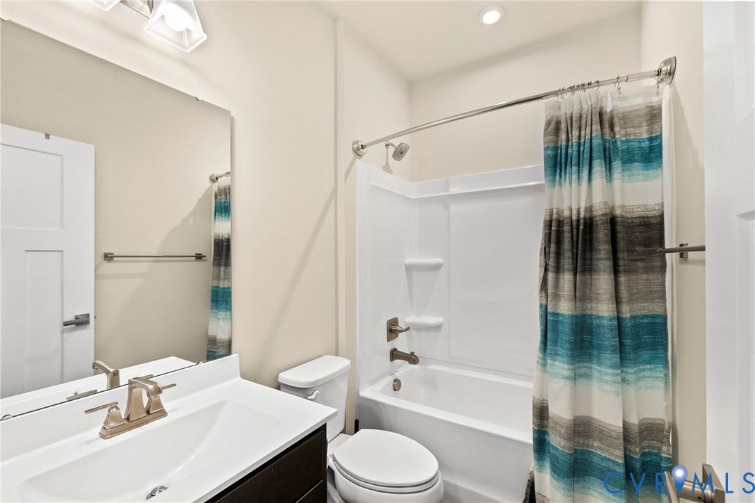 11319 Vulcan Lane, Bermuda, Chester, VA 23831 Bathroom featuring a single vanity with a rectangular sink, a white countertop, and a brushed nickel faucet