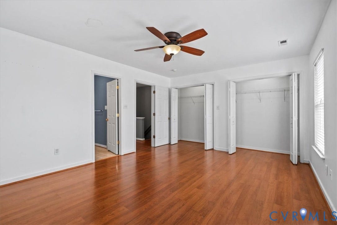 2723 Goyne Terrace, Chester, VA 23831 Wood-finish flooring, ceiling fan with light fixture, multiple bi-fold door closets, and white trim