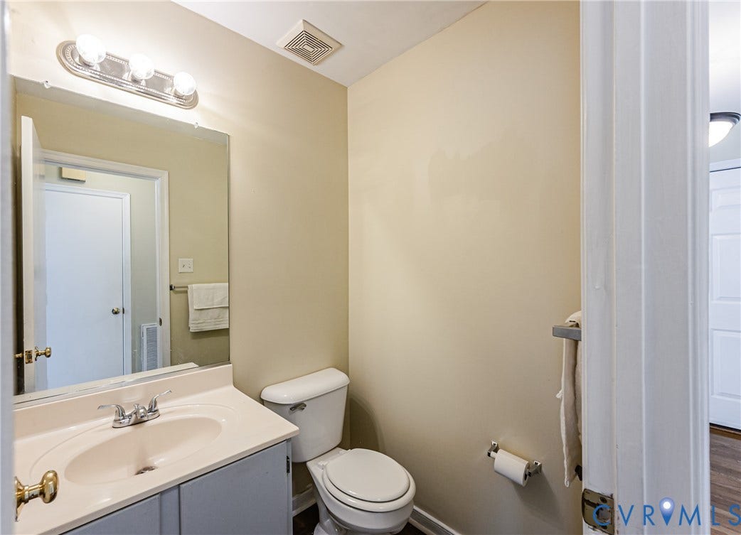 Vanity with integrated sink, chrome faucet, and under-cabinet storage
