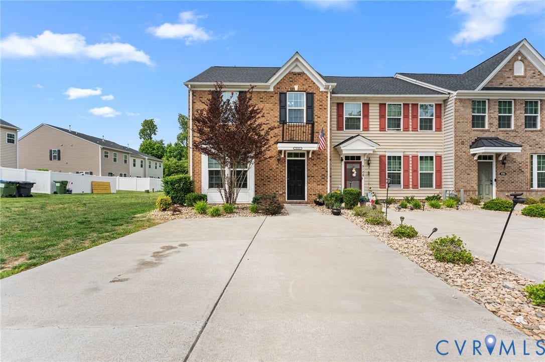 5112 Weatherby Drive, Chester, VA 23831 Brick and siding exterior with red shutters, a private balcony, and an attached portico