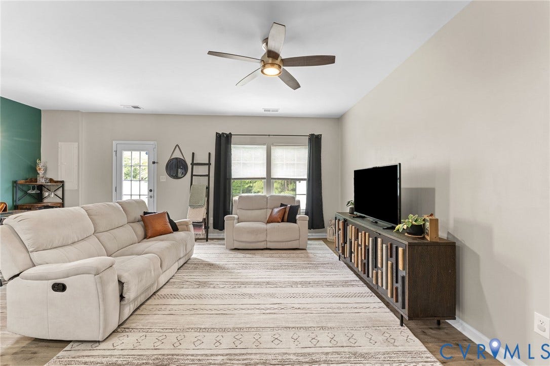 5112 Weatherby Drive, Chester, VA 23831 Recessed lighting, ceiling fan with integrated light, multiple windows with blinds, a glass-paned door, and wood-finish flooring