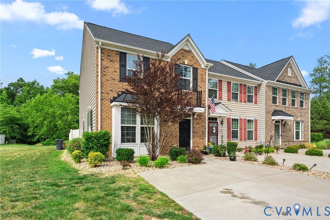 5112 Weatherby Drive, Chester, VA 23831 Brick and siding exterior with dark shutters, bay window, and a second-story balcony