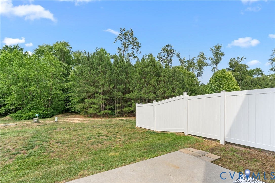 5112 Weatherby Drive, Chester, VA 23831 Expansive backyard featuring a privacy fence and concrete patio