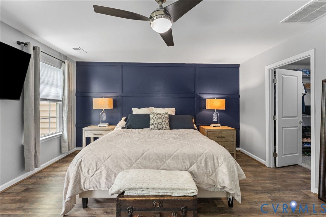 5112 Weatherby Drive, Chester, VA 23831 Wood-finish flooring, accent wall with paneling, ceiling fan with integrated lighting, window with blinds, and white paneled door