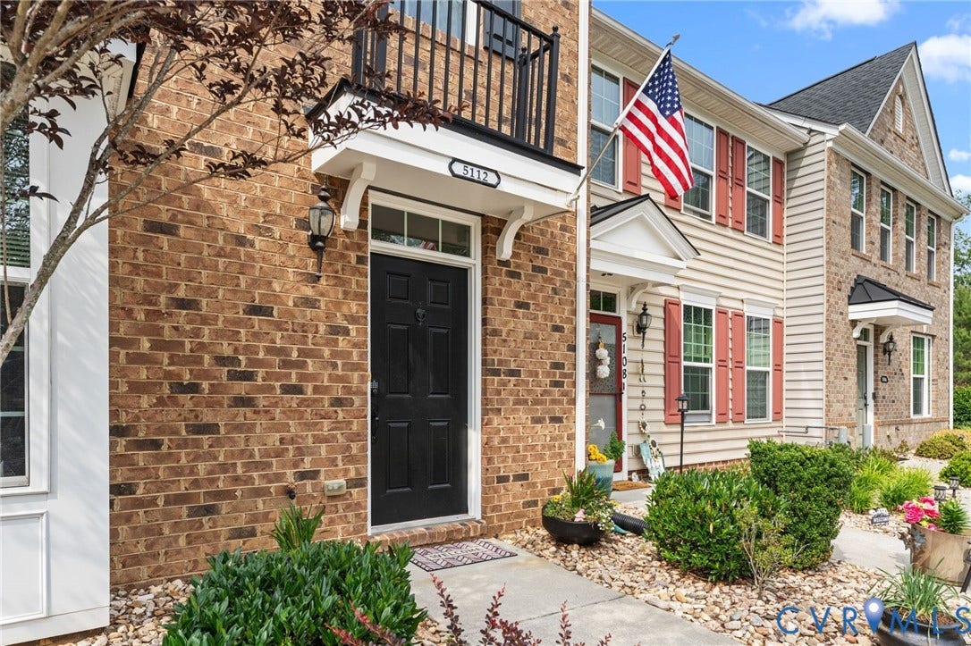 5112 Weatherby Drive, Chester, VA 23831 Brick and siding exterior with a black panel door and transom window