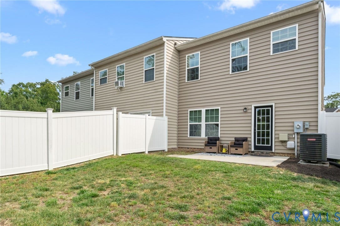 5112 Weatherby Drive, Chester, VA 23831 Private fenced yard with a concrete patio and a rear entry door