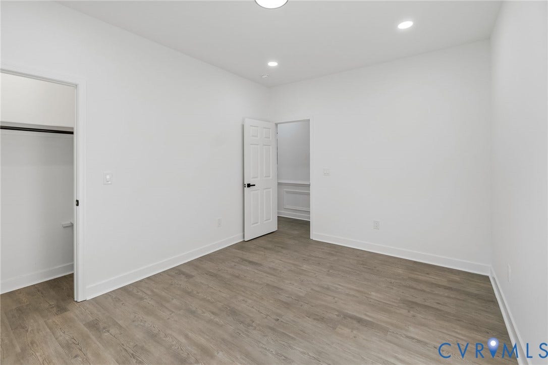 524 Cameron Street, Petersburg, VA 23803 Recessed lighting, wood-finish flooring, white walls, and a closet with hanging rod